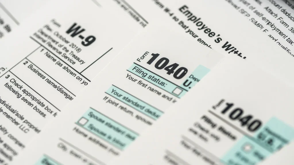 Tax forms including Form 1040 and Form W-9
